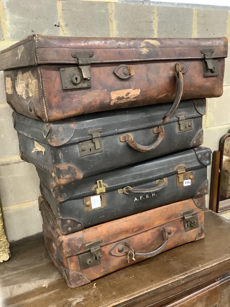 Four vintage leather cases, largest 68cm wide